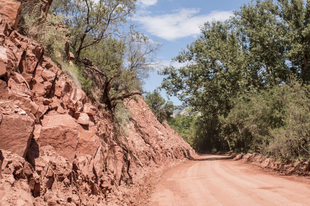 A dirt road of red earth