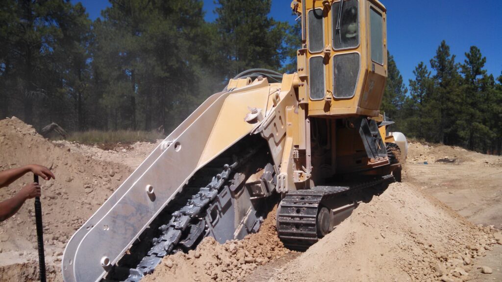 A trencher cutting a trench