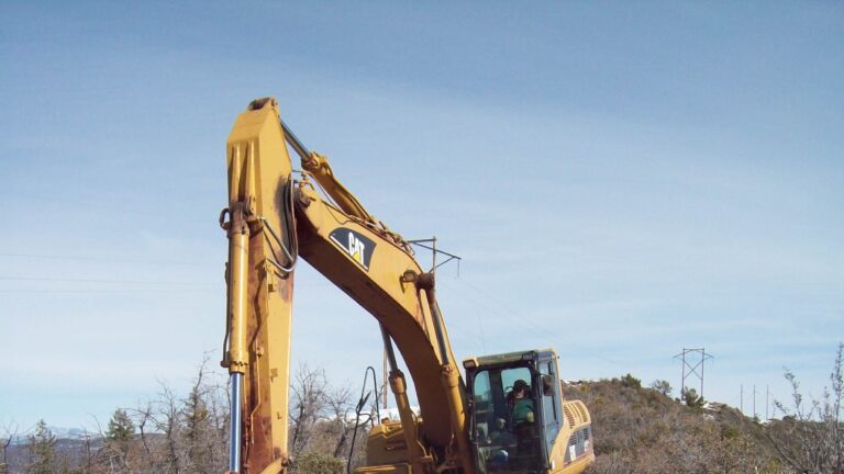 Backhoe digging in frozen ground