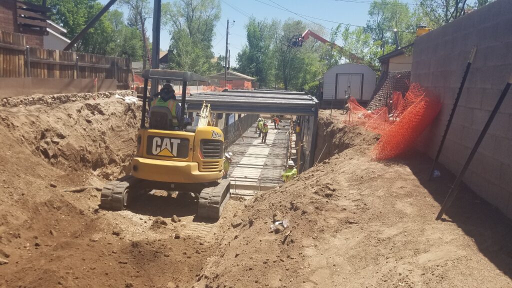 Construction workers installinng a channel