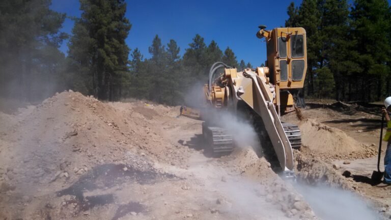 Cutting a trench with a trenching machine
