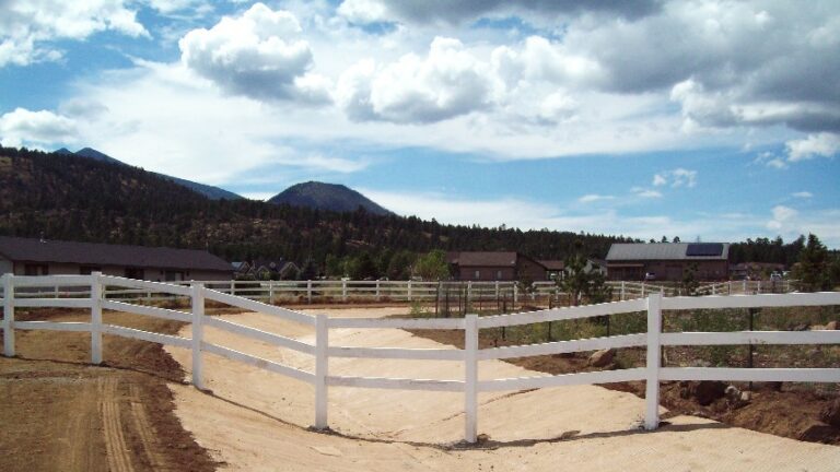 Drainage channel with a fence across it